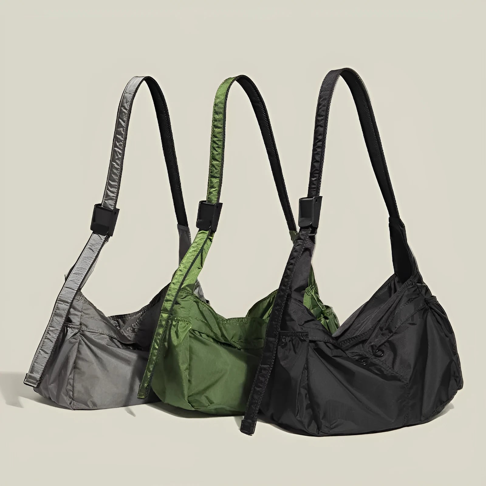 Black nylon waterproof sports style messenger bag with horizontal square design and shoulder strap