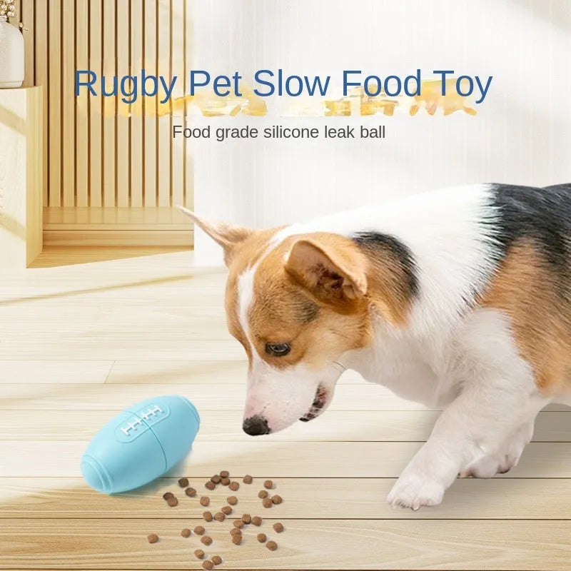 Blue silicone rugby ball dog toy with hollow treat compartment on a wooden floor