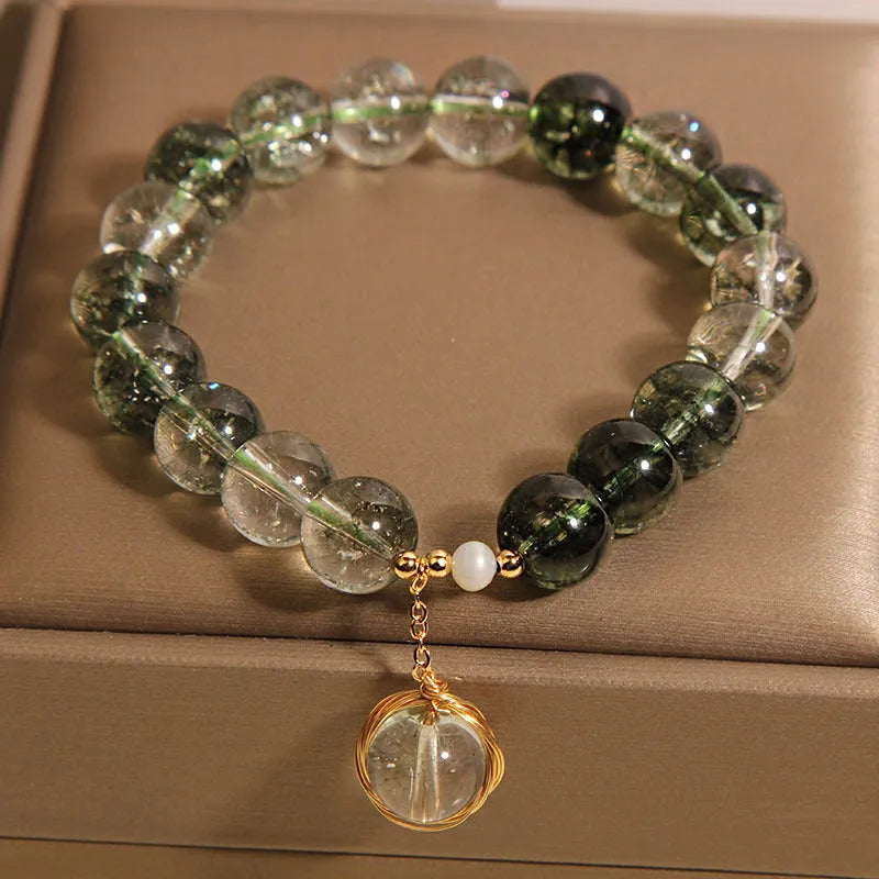 Green phantom quartz and chorite crystal bracelet with winding transfer beads