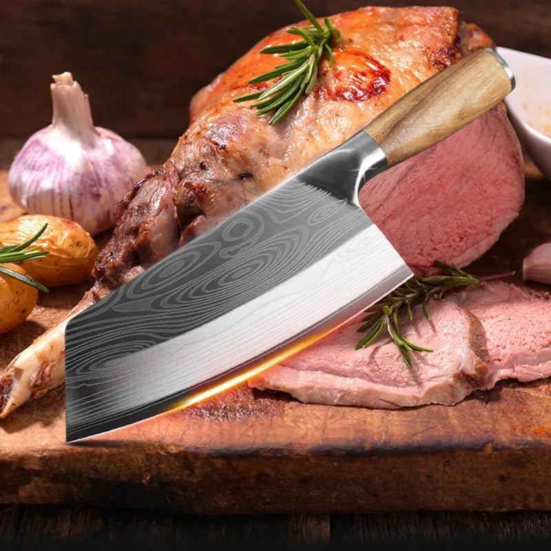 A stainless steel kitchen knife with a 320mm blade on a wooden cutting board.