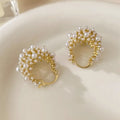 Gold women's earrings with flower basket design and small rice-shaped beads