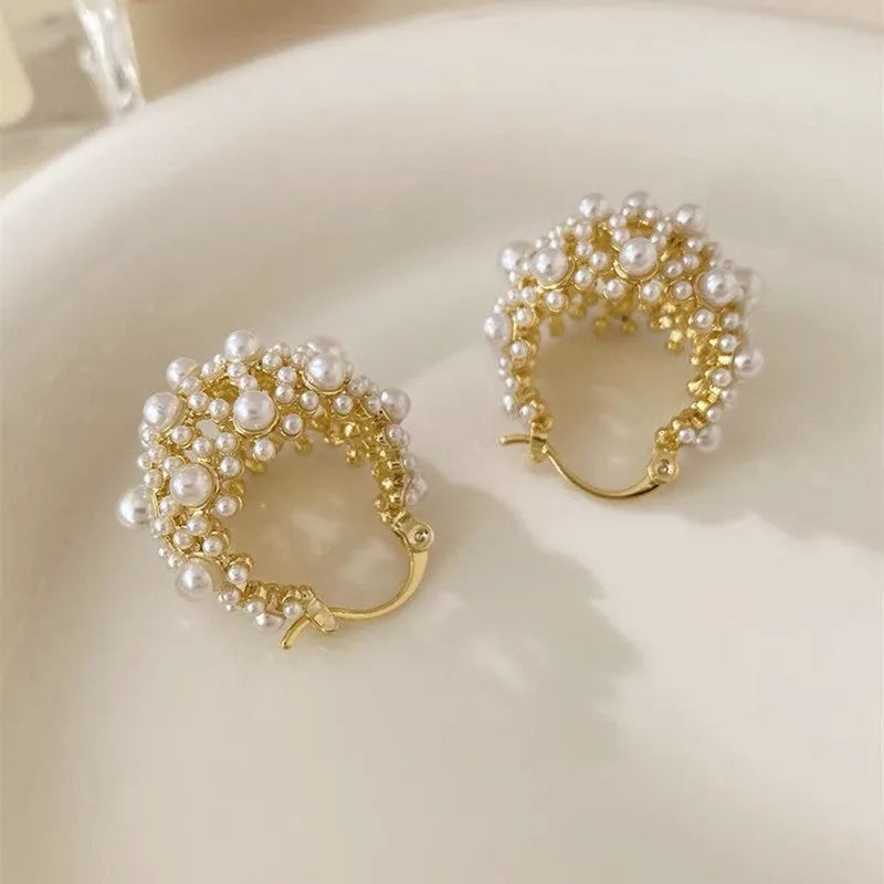 Gold women's earrings with flower basket design and small rice-shaped beads