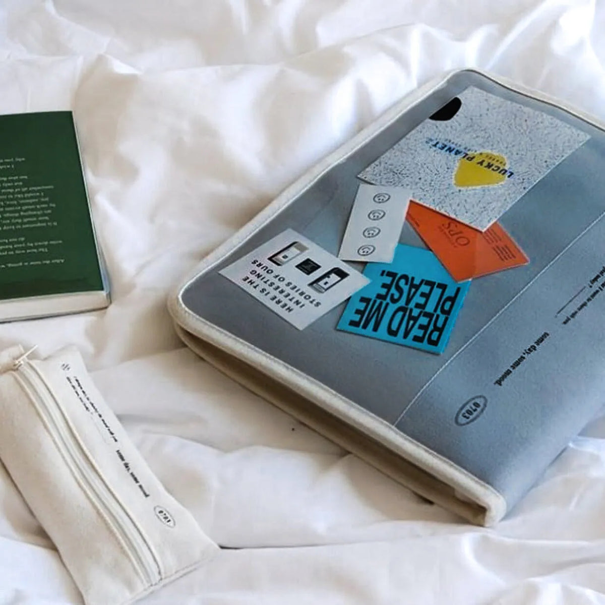 12 inch canvas tablet sleeve bag with zip opening, soft handle, clutch style, in black or white.