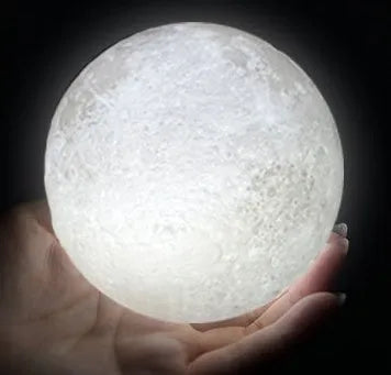 3D printed white moon lamp with detailed craters on a wooden holder, showing touch ring at base.