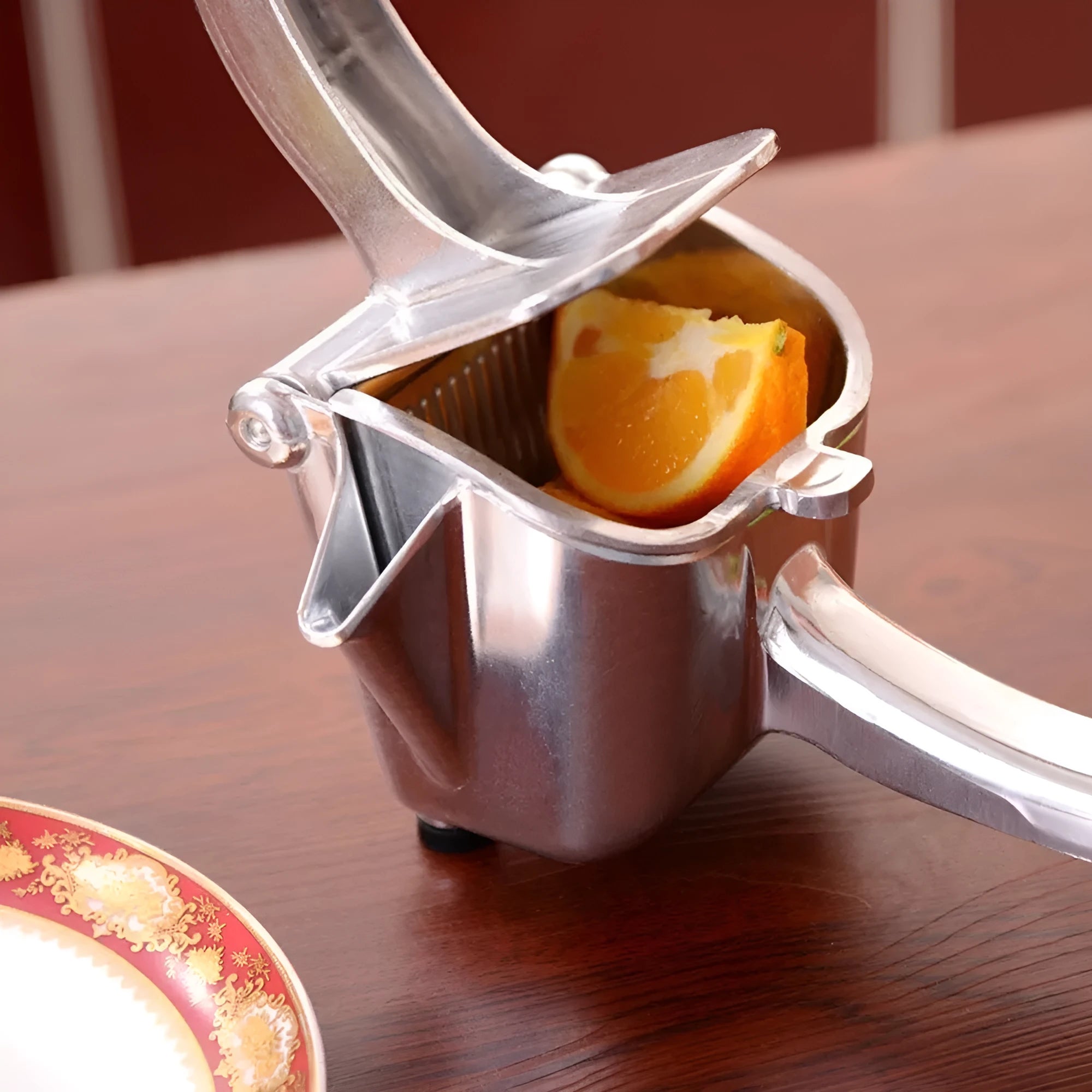 Silver heavy-duty aluminium alloy lemon squeezer with large bowl and press lever.