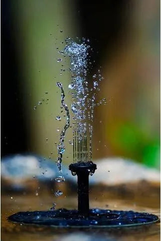 Black solar-powered garden water fountain pump with four different spray nozzle attachments