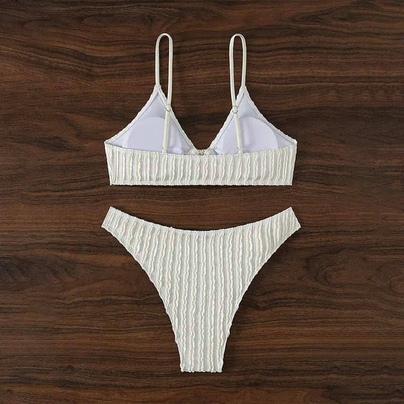 White women's swimsuit with V-neck top and matching shorts for swimming