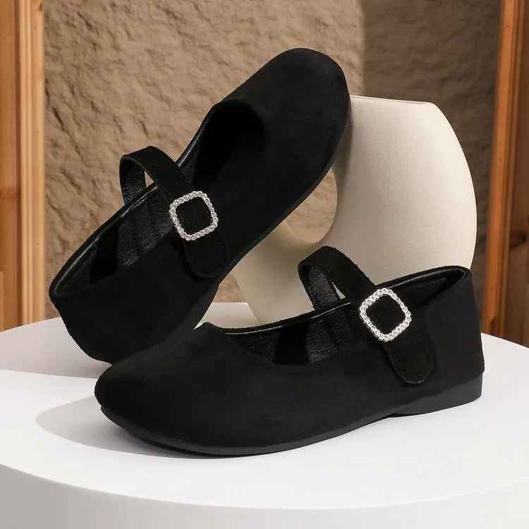Women's solid black casual flat fisherman shoes with canvas upper and rubber sole.