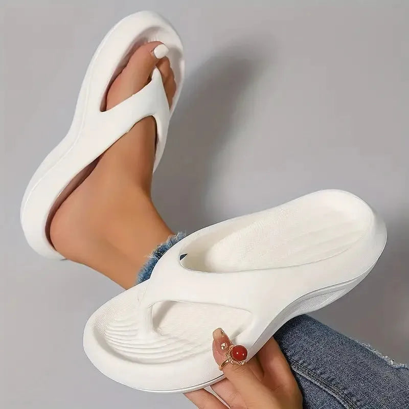 Women's black thick-soled EVA flip-flops with a non-slip sole pattern