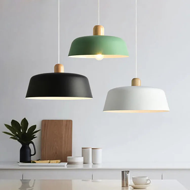 Round zinc alloy Nordic pendant hanging lamp in black finish with 38cm diameter over a dining table
