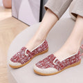 Women's ethnic style flat cloth shoes in red with colour stitching and a beef tendon sole.