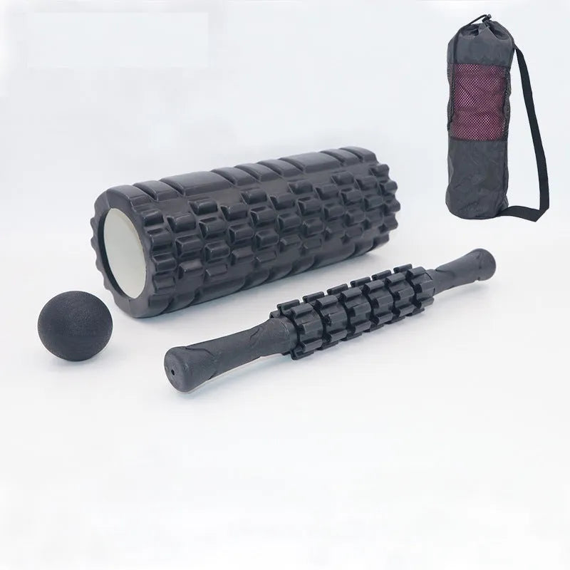 Black 33cm fitness foam roller and massage stick set on a grey background.