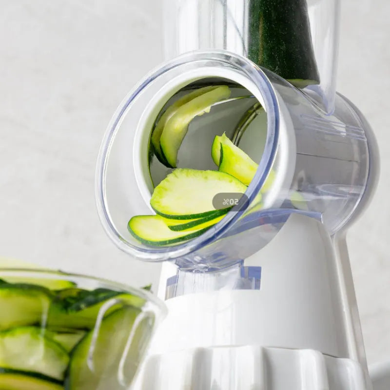 White 3-in-1 manual vegetable slicer with stainless steel blades on kitchen counter