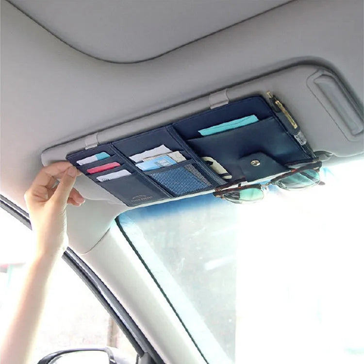 PU leather car sun visor clip organiser in black, grey and beige with slots for phone, sunglasses, CDs, and documents.