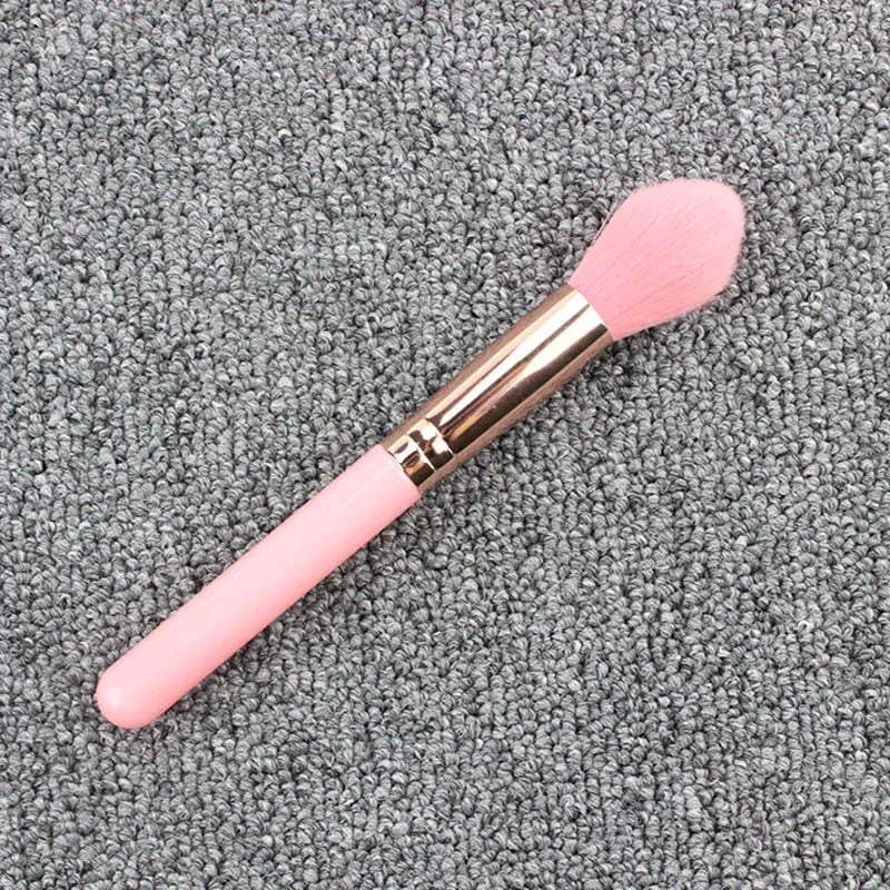 Pink blush brush with corrugated silk nylon wool bristles and plastic handle for highlight application
