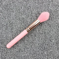 Pink blush brush with corrugated silk nylon wool bristles and plastic handle for highlight application
