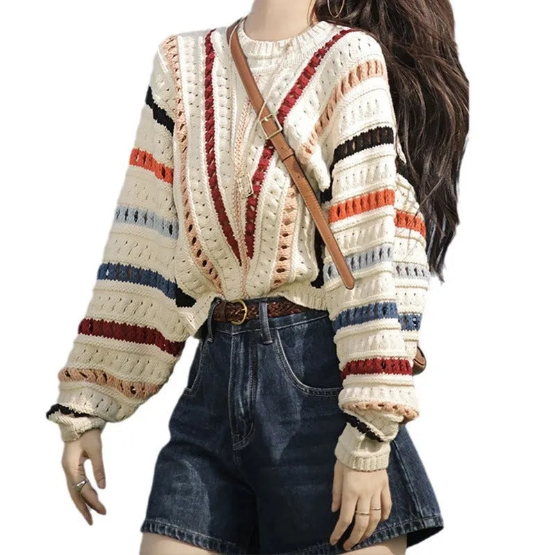 Colourful rainbow striped loose-fit pullover sweater with batwing sleeves and a round neck.