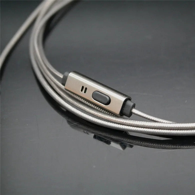 Titanium grey metal in-ear earphones with a braided aluminium foil and TPE cable and detachable connectors.