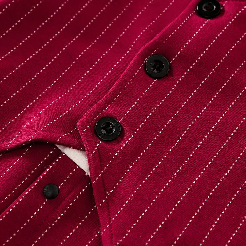 Baby boy wearing a wine red cotton gentleman jumpsuit with long sleeves and single-breasted closure.