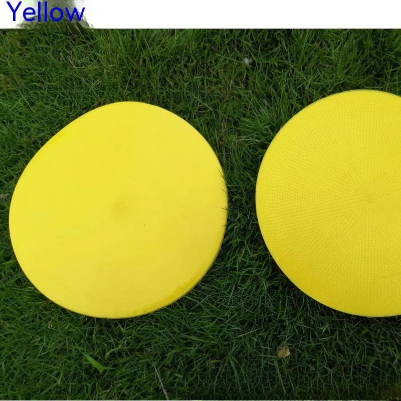 Yellow 23cm diameter flat TPE football training marker disc on grass
