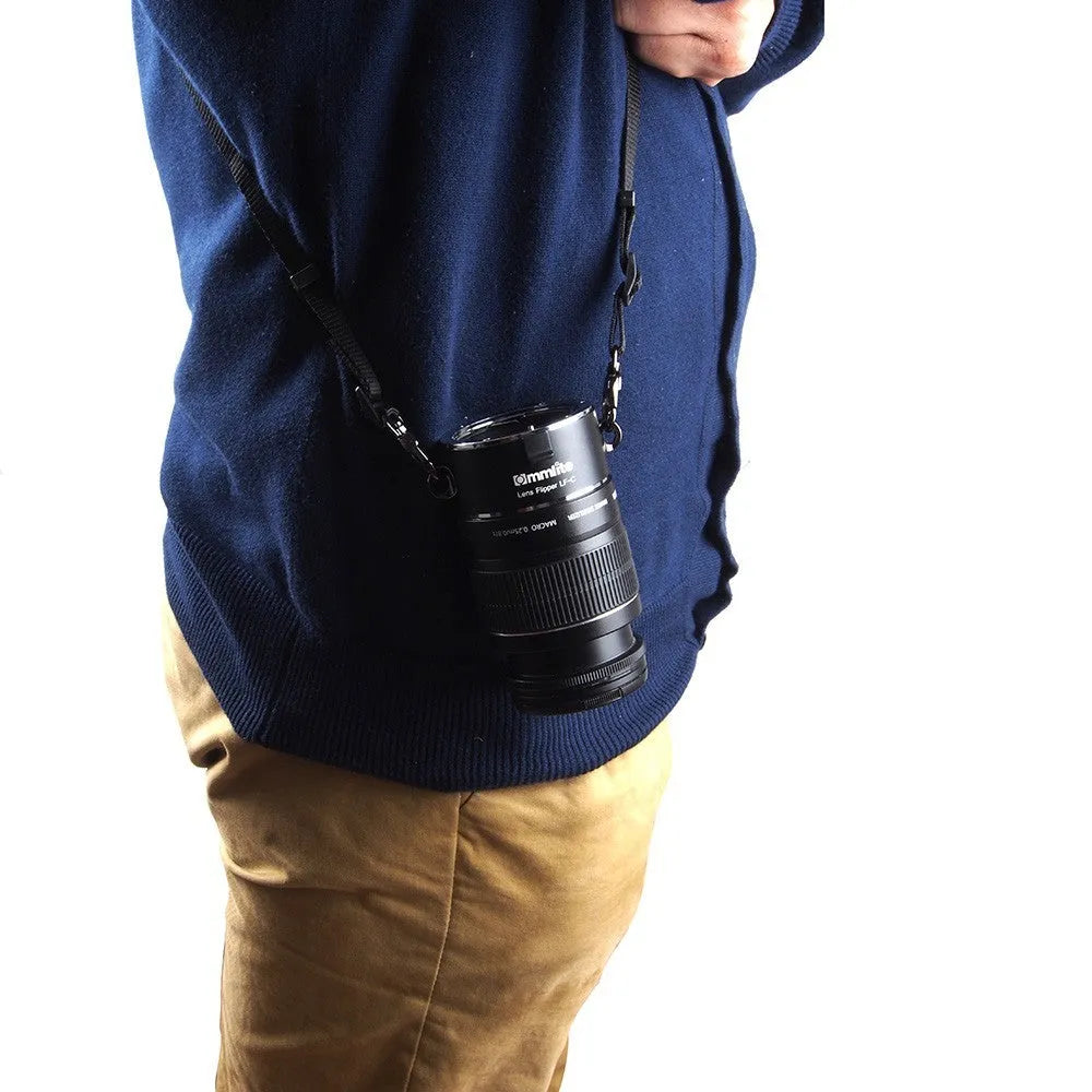 Aluminium camera lens flipper holder on a cotton shoulder strap for quick lens changes