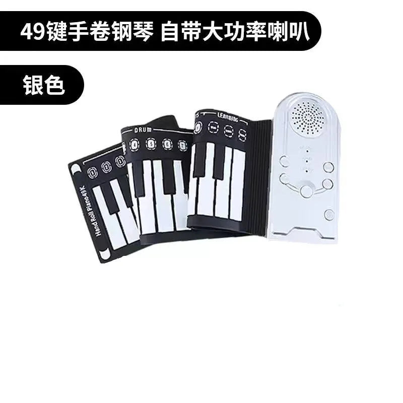 Pearlescent white portable electronic keyboard with 49 silicone keys, rolled up next to its compact ABS plastic control unit.