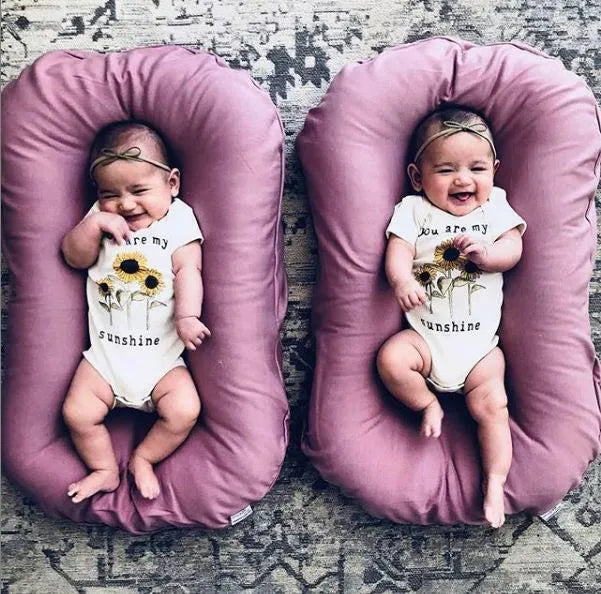 Portable baby nest crib in beige cotton measuring 45x75cm for infants
