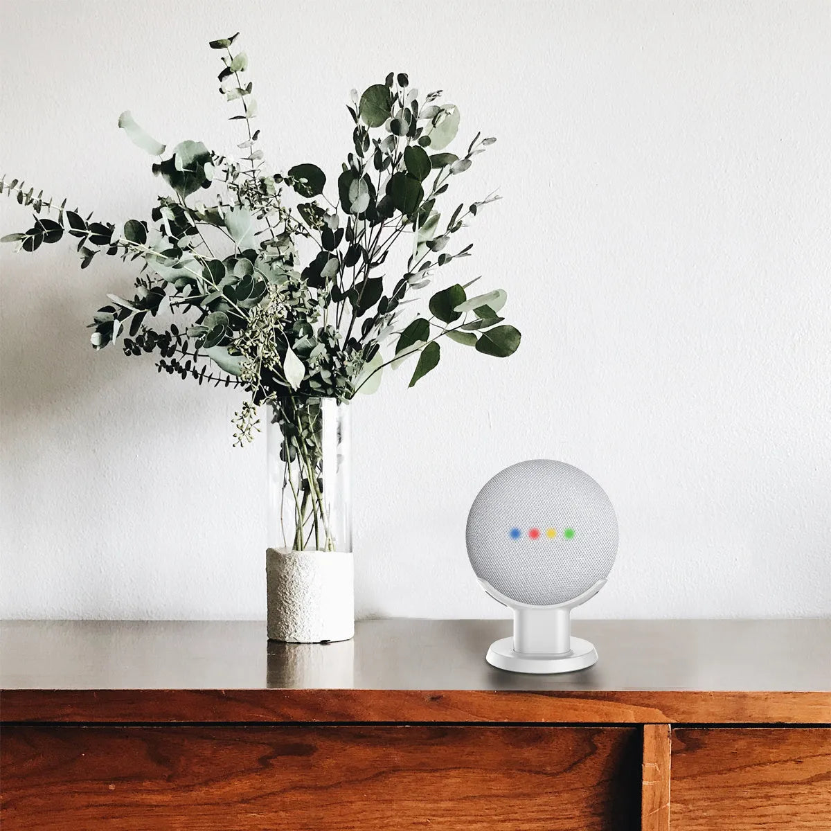 PlusAcc black plastic stand holder for Google Home Mini voice assistant on a table