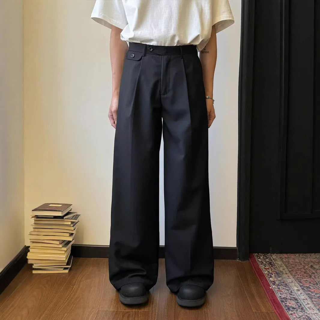 Man wearing brown straight wide-leg casual suit trousers made from a polyester blend fabric.