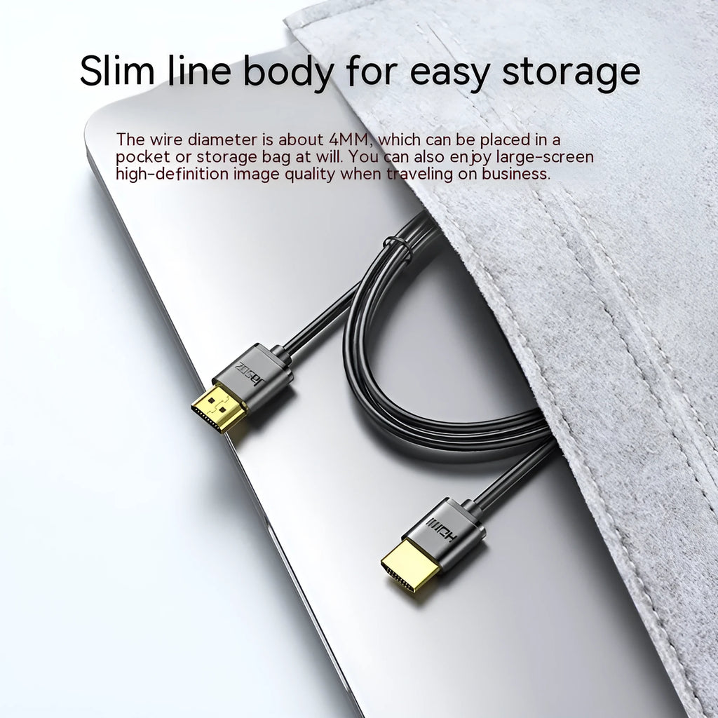 Gold-plated HDMI to HDMI cable with thin flexible wire on a white background.
