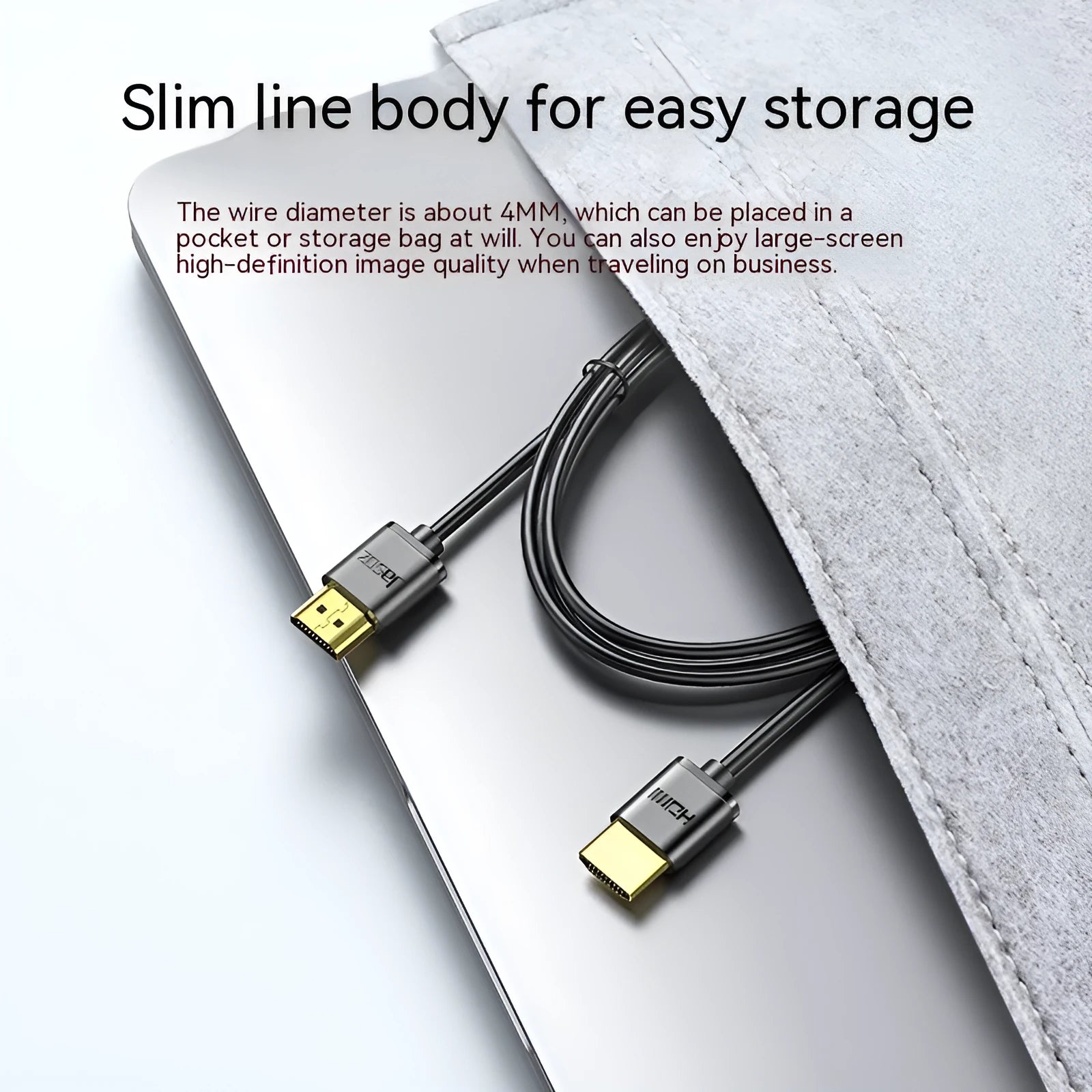Gold-plated HDMI to HDMI cable with thin flexible wire on a white background.