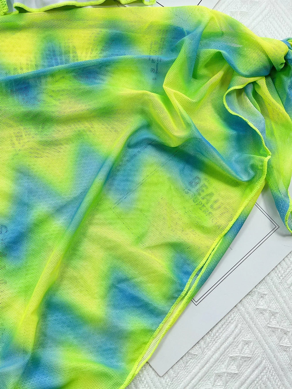 Green tie-dyed women's swimsuit bikini set with bra, briefs, and removable skirt