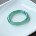 Natural agate wide tire bracelet shown in pink, available in sizes 52mm to 62mm.