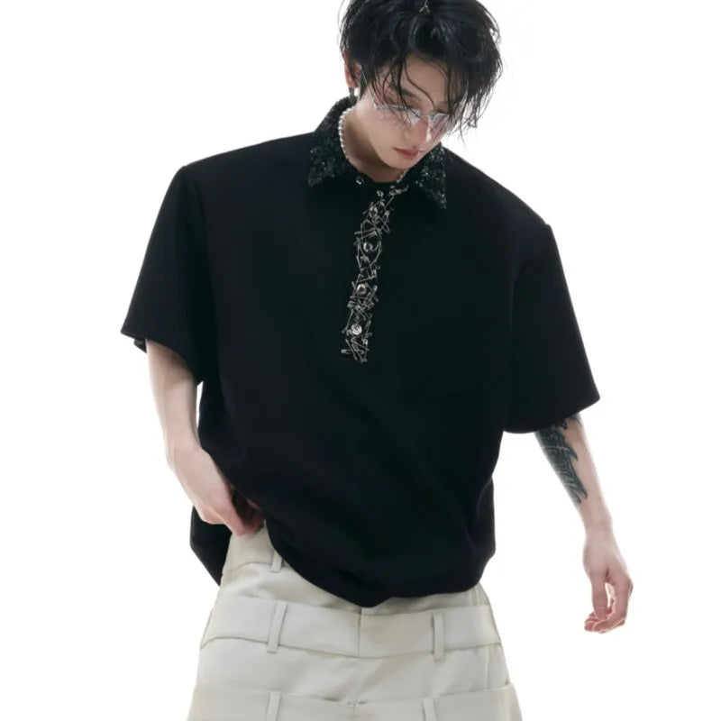Men's black polo t-shirt with heavy embroidery and sequin decoration, square collar, and short sleeves.