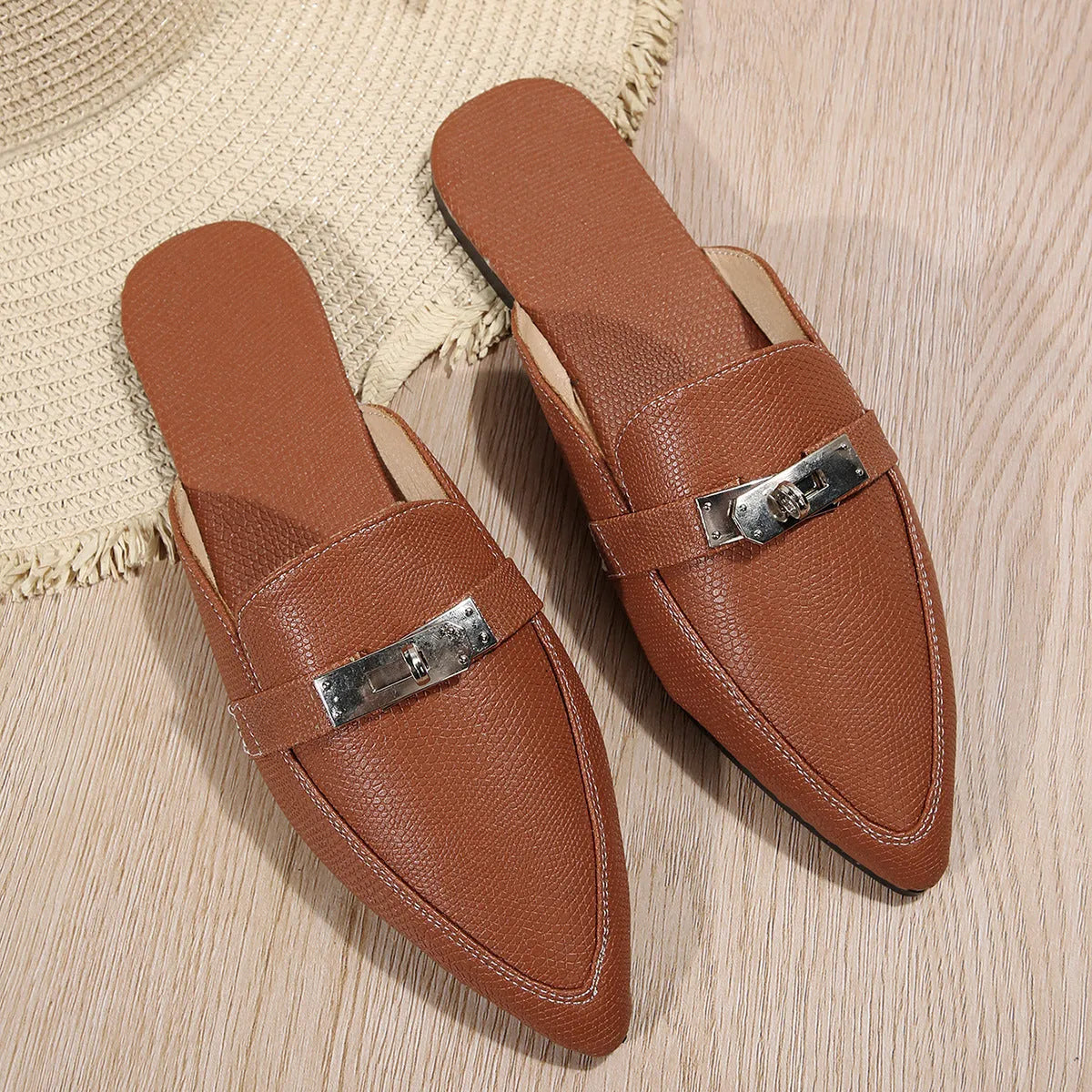 Light brown women's pointed toe slip-on shoes with low heel and rubber sole