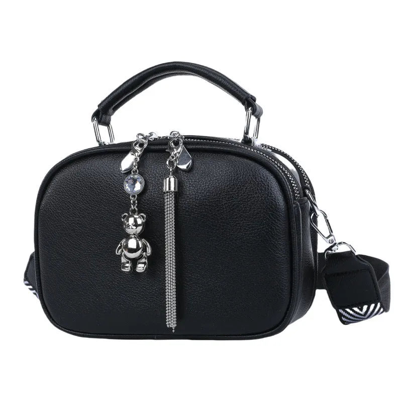 Oval-shaped women's small square bag in soft PU leather with double strap, shown in multiple colours.