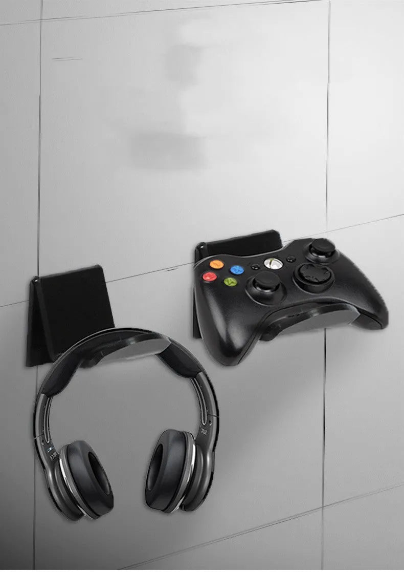 Universal plastic game controller bracket in black colour showing mounting points for installation