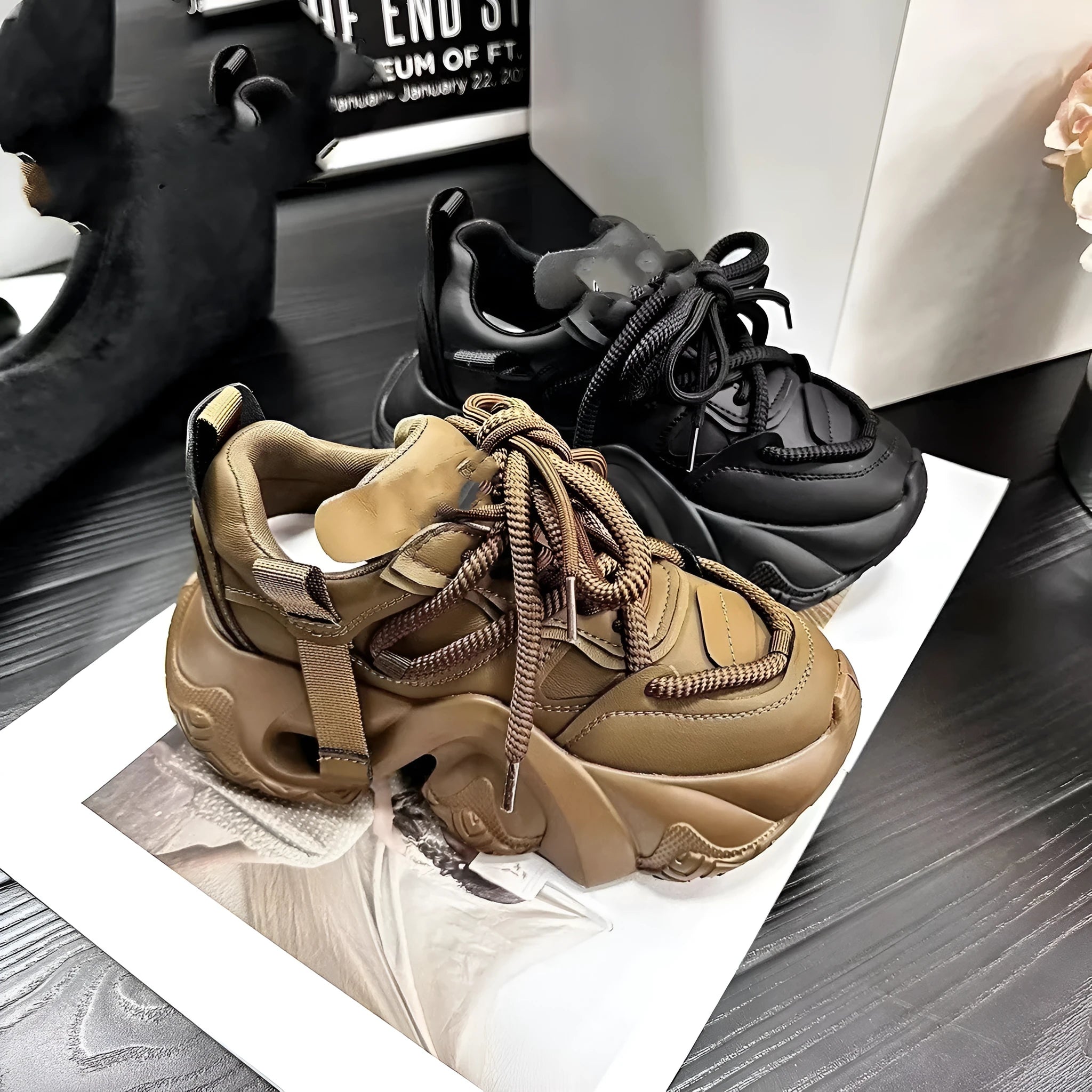 Women's creamy white platform sneakers with a thick wedge sole, lace-up front, and cross-strap detail.