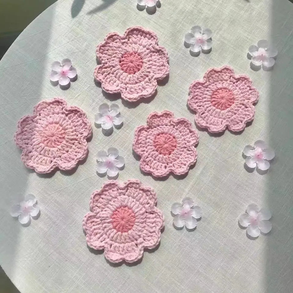 Hand-woven wool drink coaster on a wooden table