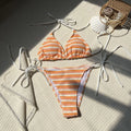 Women's striped split bikini set in pink, made from polyester, with briefs style pants