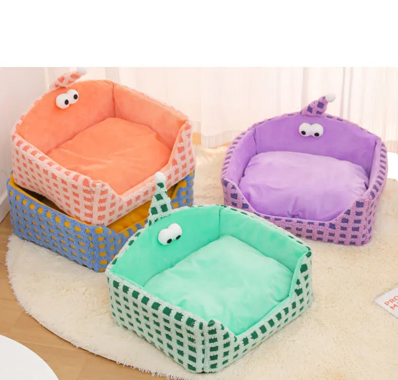 Green triangular pet bed with thick sponge and a removable cover for cats.