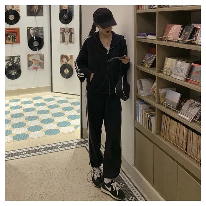 Women's two-piece striped polyester tracksuit set, light gray, top and trousers on plain background