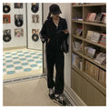 Women's two-piece striped polyester tracksuit set, light gray, top and trousers on plain background