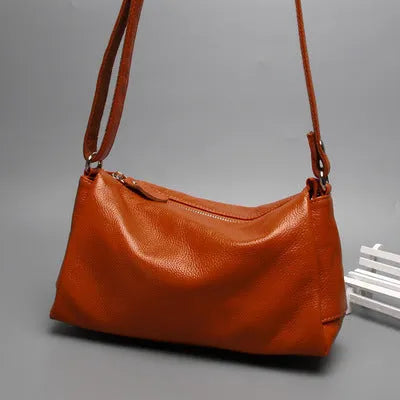 Soft genuine leather women's crossbody bag in horizontal square shape with an outer pocket.
