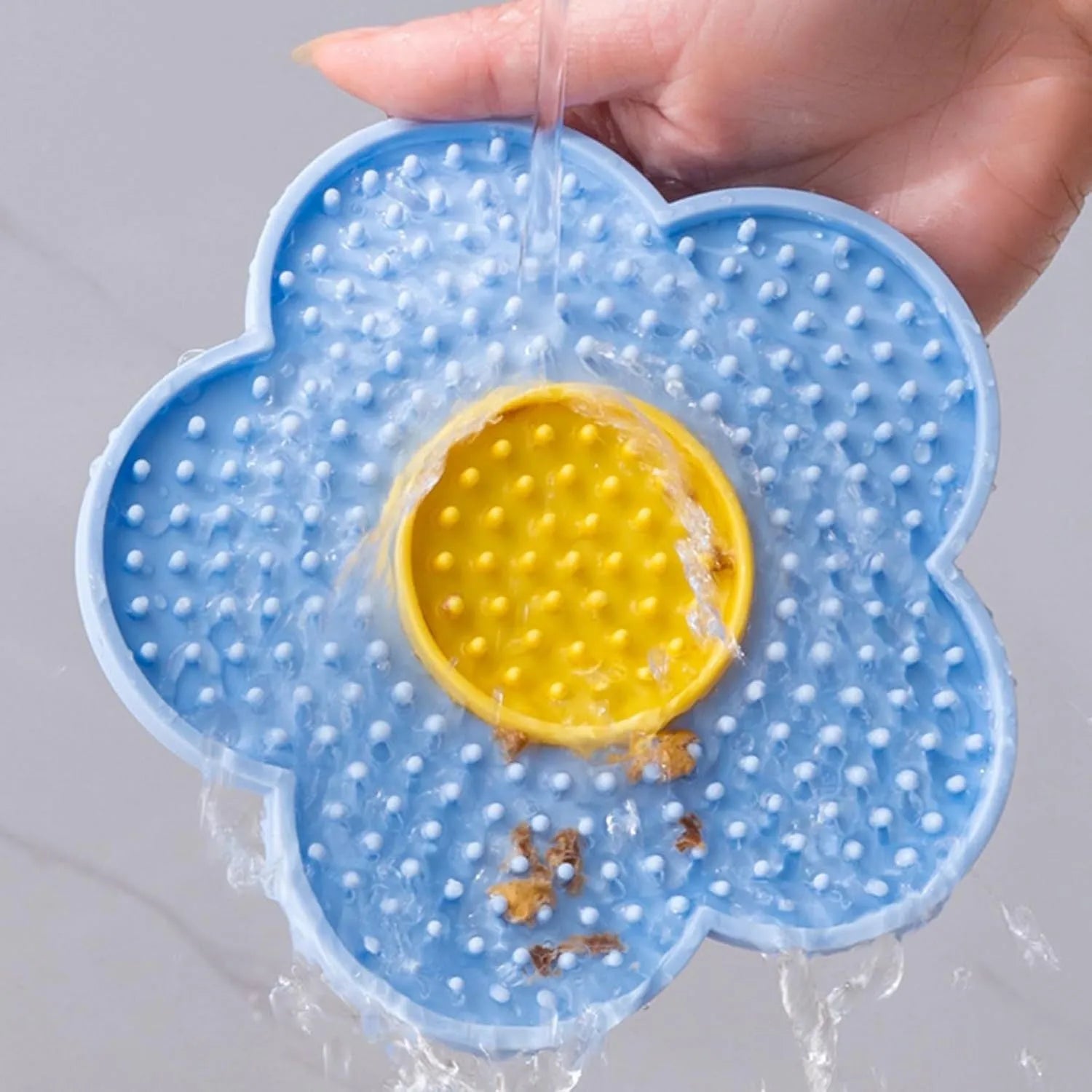 Flower-shaped silicone lick pad for pets with suction cups on smooth surface