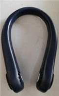 White rechargeable bladeless neck fan hanging around a person's neck showing its hands-free design