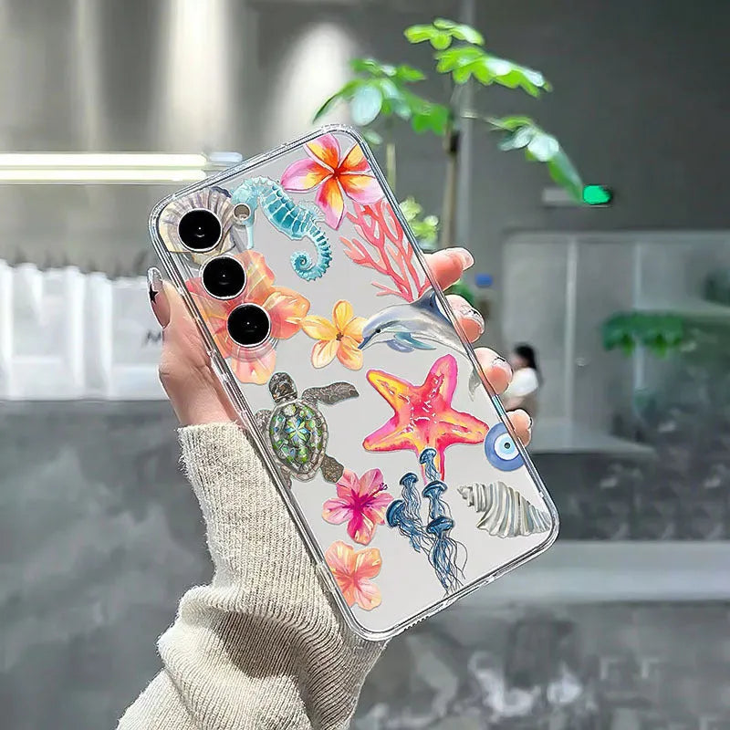 Clear TPU iPhone case with painted dolphin, turtle, plant, and shell design for anti-fall protection.