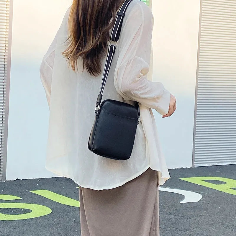 Small solid colour crossbody shoulder bag for mobile phones in beige.