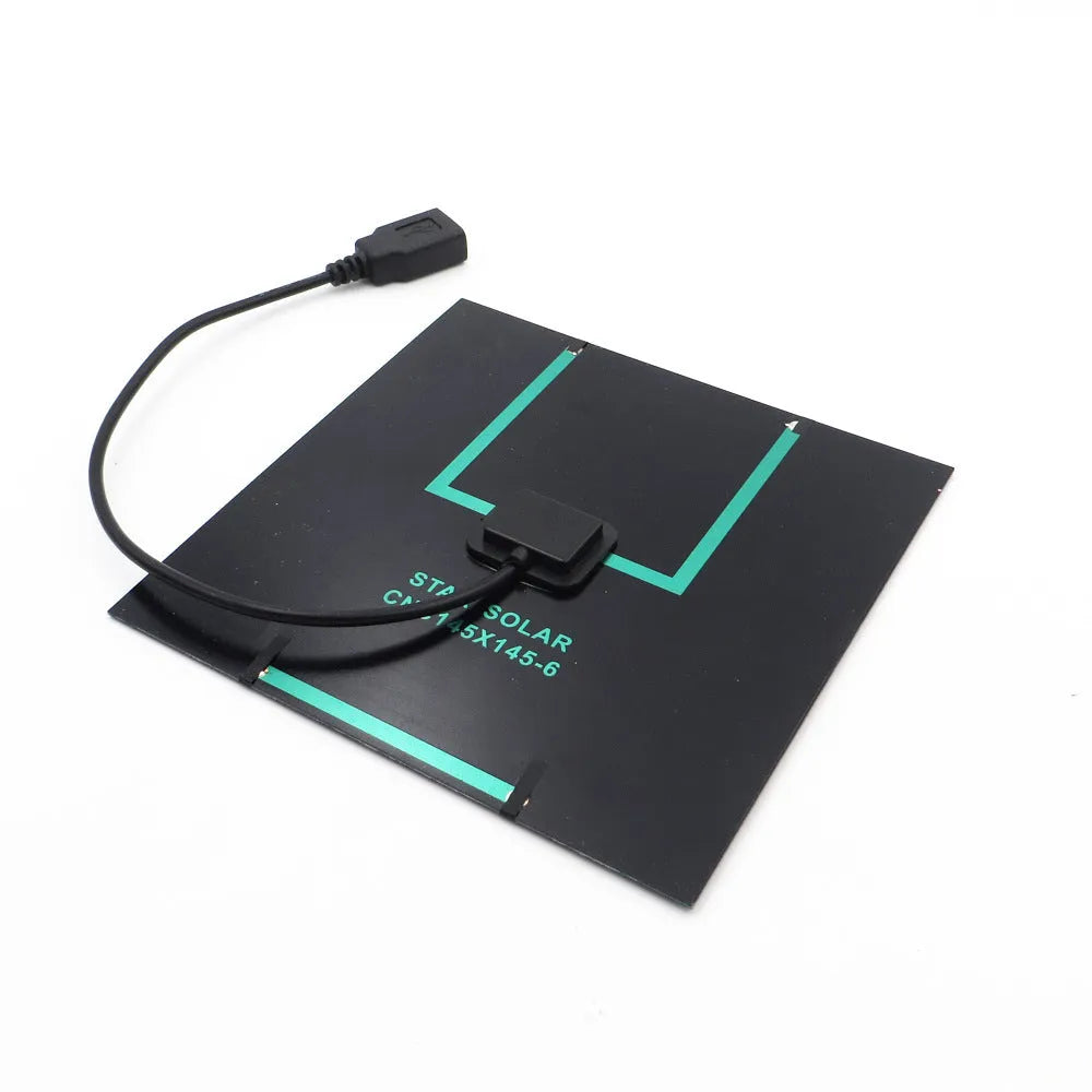 Portable solar panel unit with a small fan and a USB charging port for mobile phones.