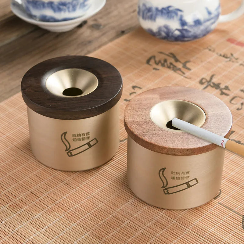 Retro solid copper ashtray with a wooden lid featuring a centre hole, shown with black and red wood options.